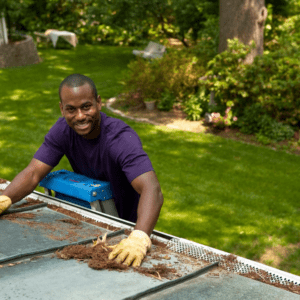 A man cleaning the roof