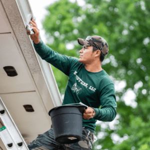 A man wiping the gutter